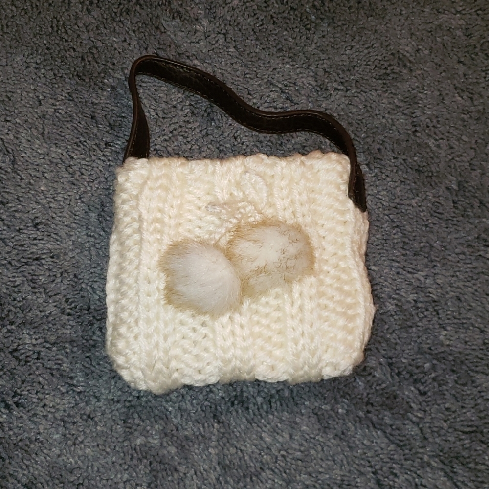 Small white child's purse